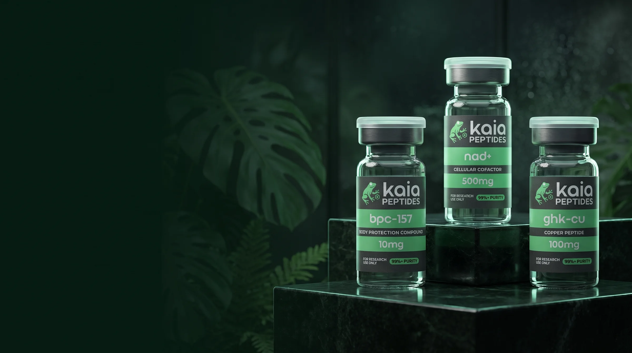 Kaia BPC-157, NAD+ and GHK-Cu research vials in a dark glasshouse